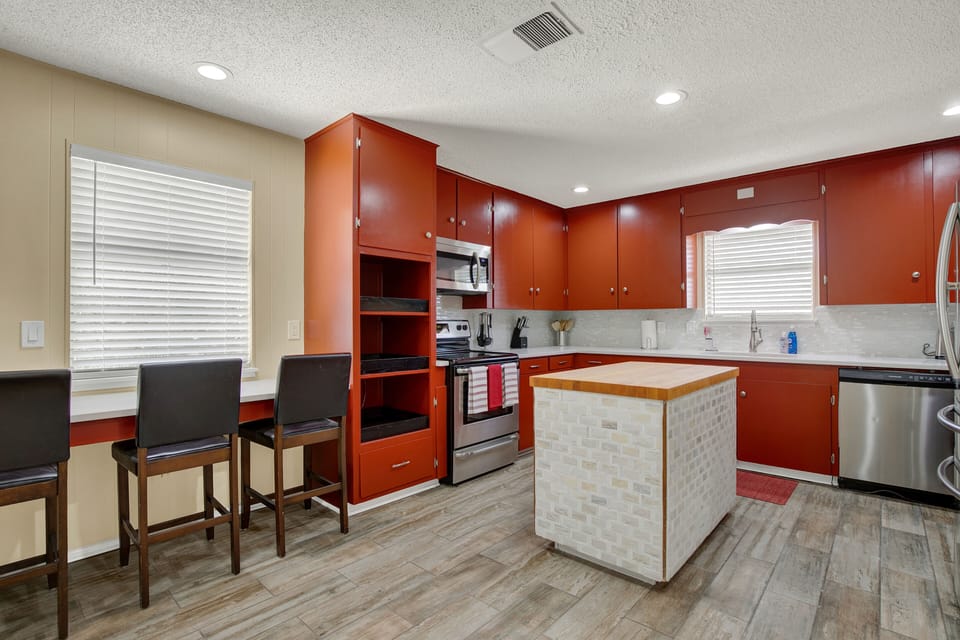 Huge island with Butcher Block top ready for those family meal preps 