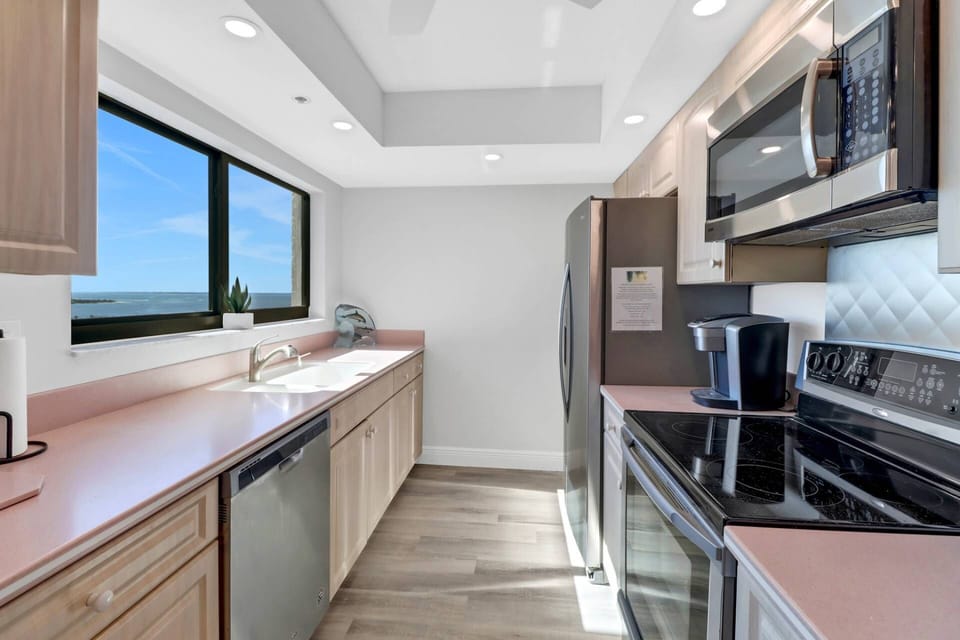 The galley style kitchen offers full size appliances, ample counters and cabinet space.