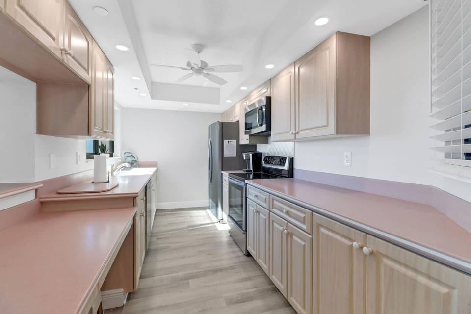 Cookware, dinnerware and many electrical appliances and kitchen tools are provided, including a Keurig coffee maker.