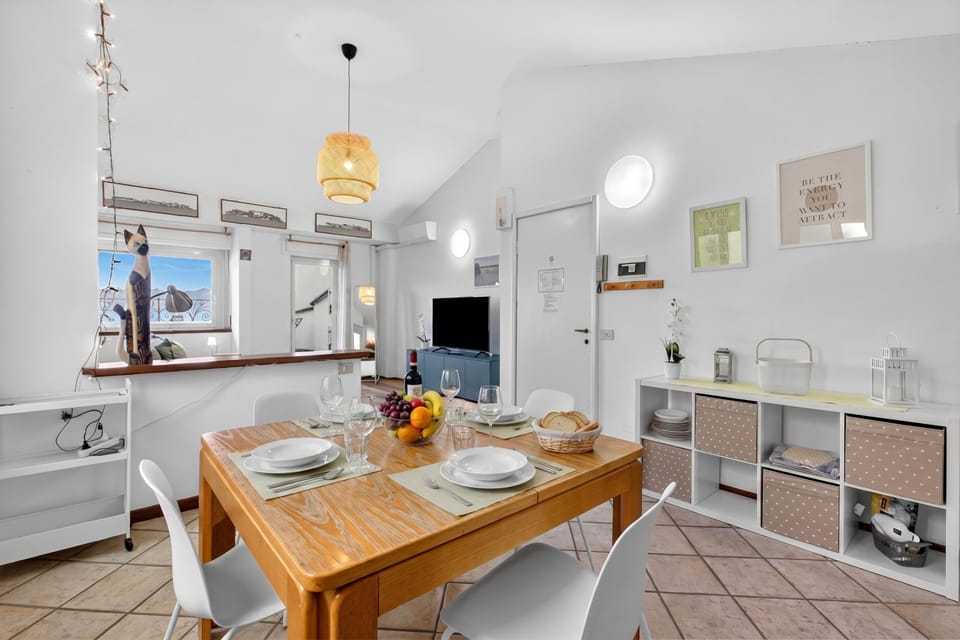 Family Penthouse, Multiple Bedrooms, Beachside (Rooftop On Stresa Lake View) | Dining
