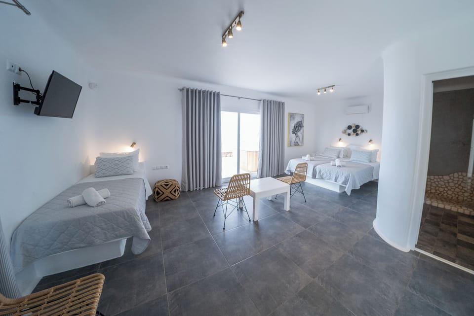 Deluxe Triple Room, Jetted Tub, Sea View | Free minibar items, in-room safe, iron/ironing board, free WiFi