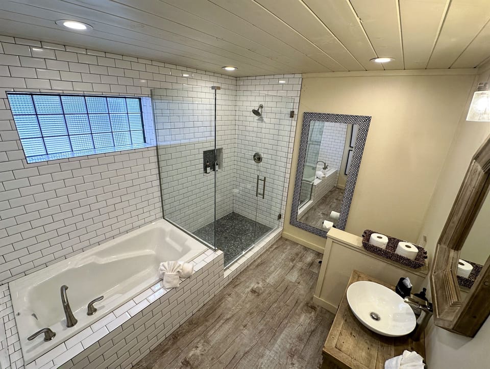 Inviting bath and shower combo in a modern bathroom.