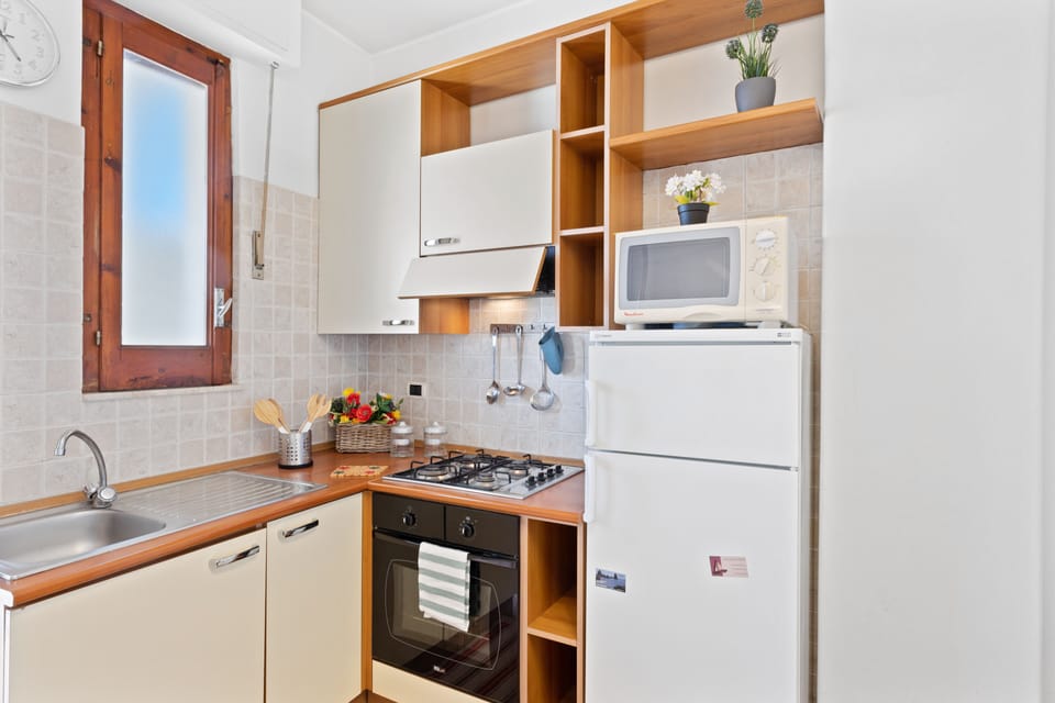 Apartment | Private kitchen | Full-size fridge, microwave, oven, stovetop