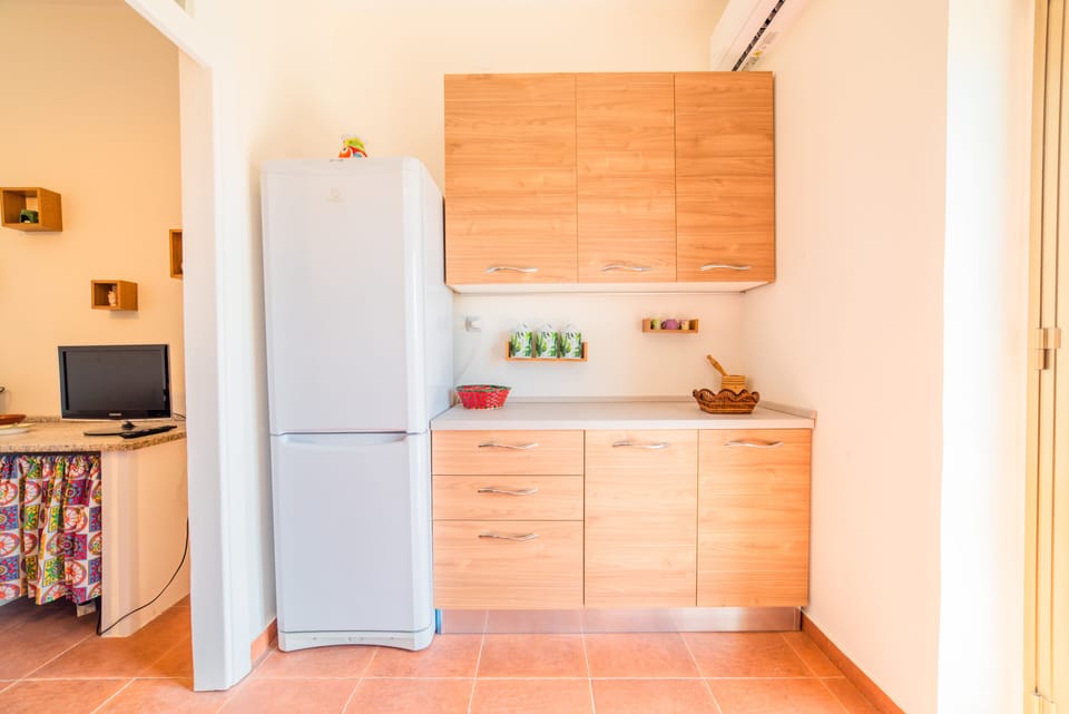 Apartment | Private kitchen | Full-size fridge, microwave, oven, stovetop
