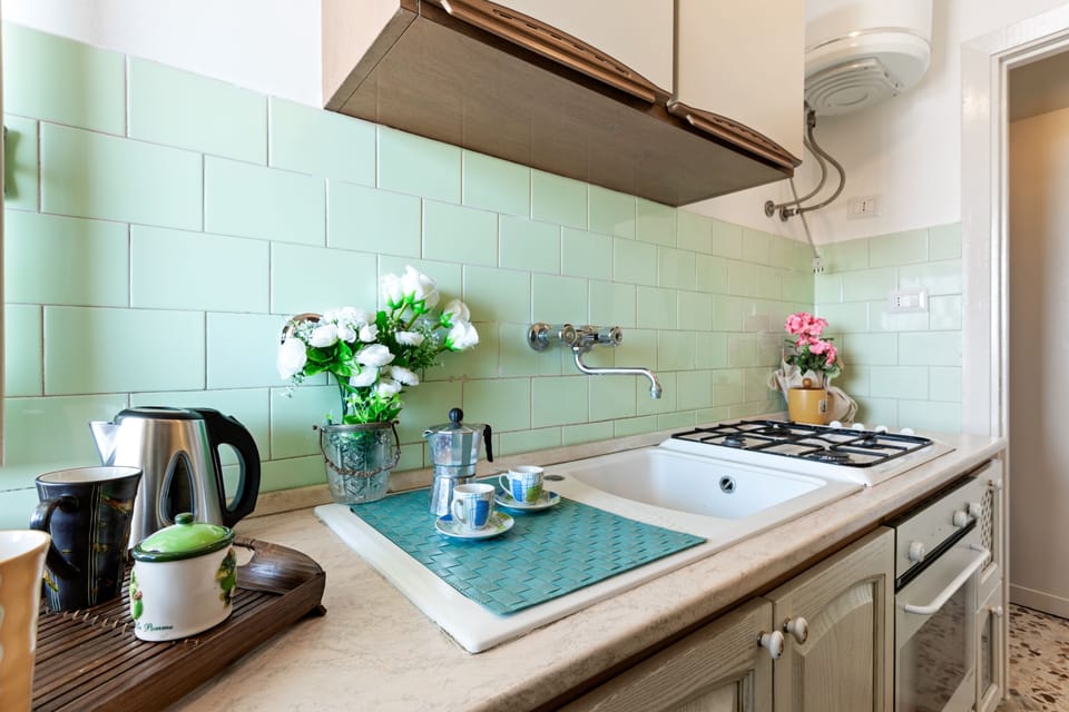 Apartment | Private kitchen | Full-size fridge, oven, stovetop, cookware/dishes/utensils