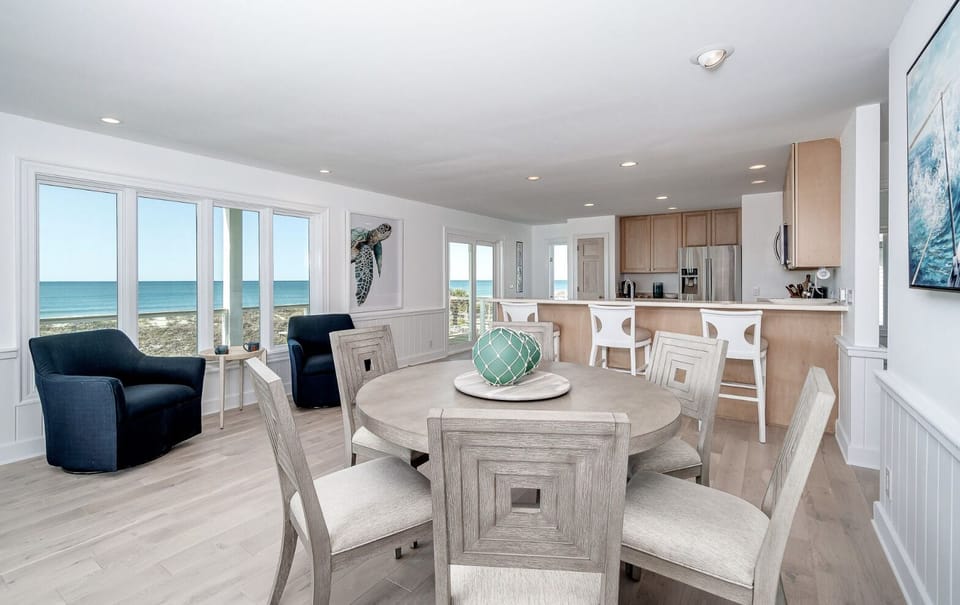 Two dining areas provide seating for 16 and ocean views in great room 