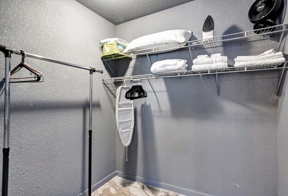 Spacious walk-in closet for storage and all extra linens and amenities can be found here