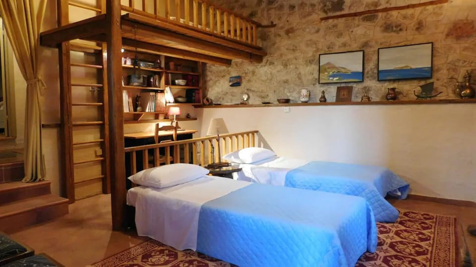 Second room has two beds, a loft with a double bed, a child's bed and a desk