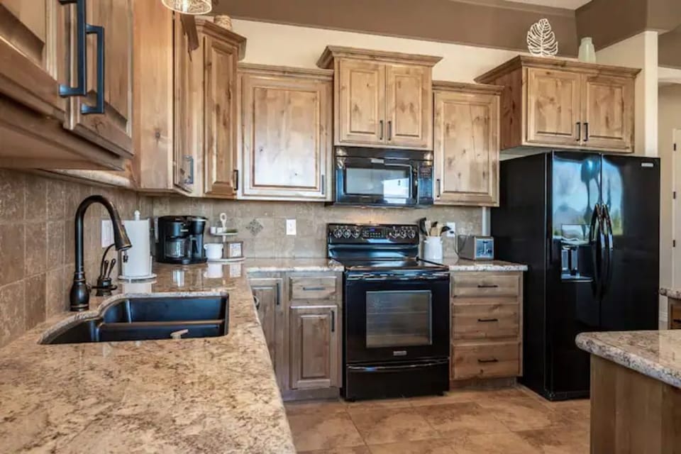 Large kitchen with all the appliances to cook.