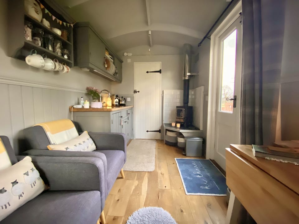 Inside your shepherds hut (the other side!).  En suite shower room thru door.