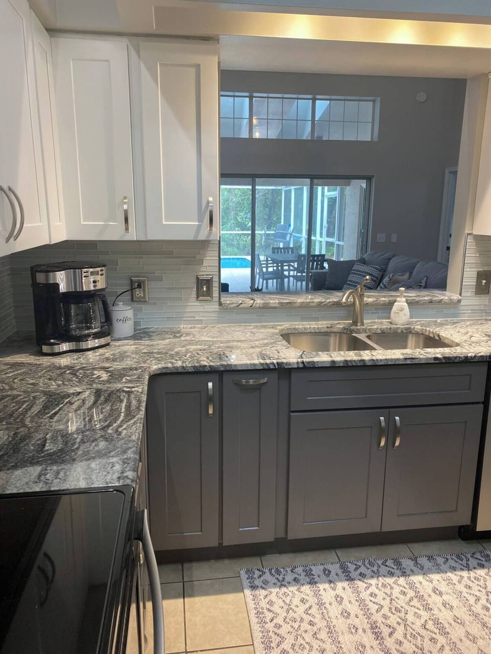 The kitchen opens up to the gathering room and has a geat view of the pool