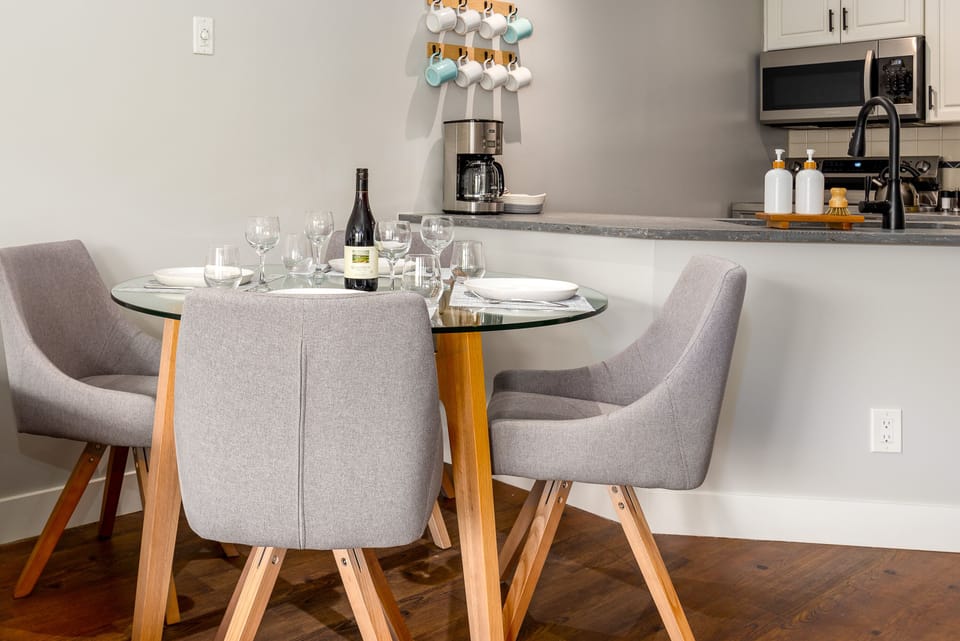 Dining Area - Industrial chic decor, seating for 4, perfect for home meals.