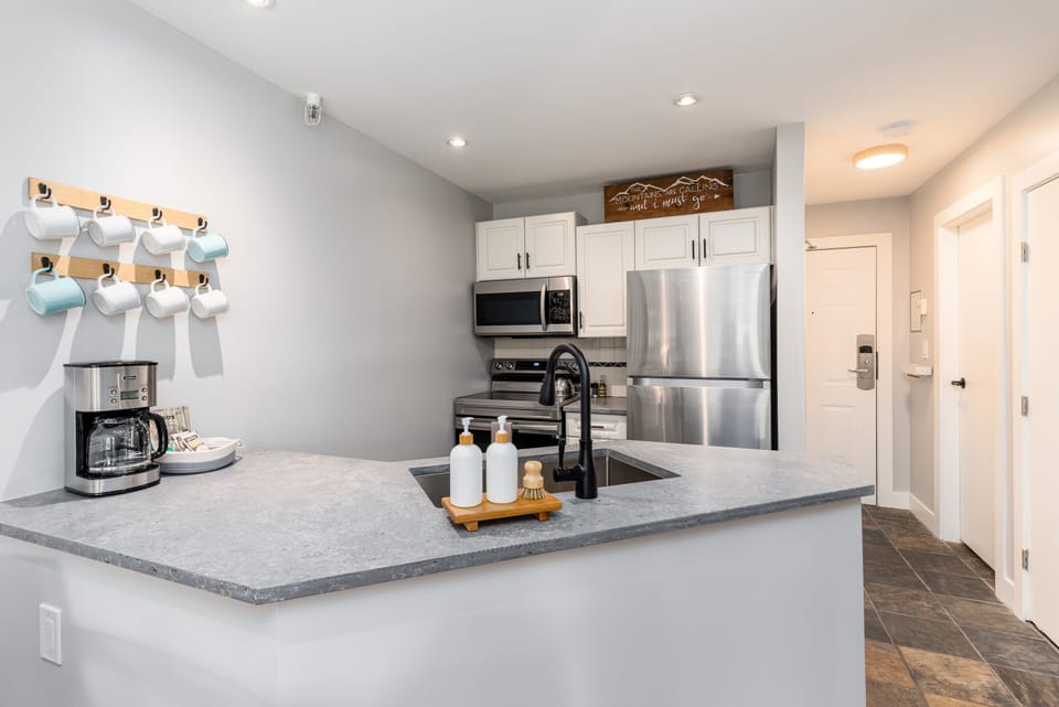 Kitchen - Brand new modern appliances and countertop make your stay as easy and comfortable as your own home.