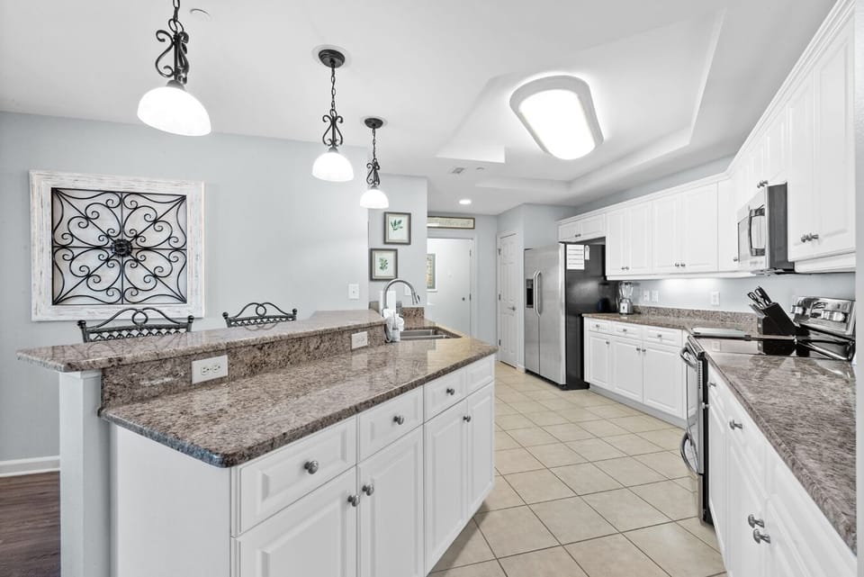Kitchen upgrades include granite countertops and stainless steel appliances.