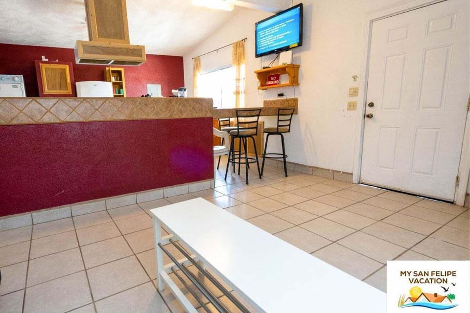 Relax in the spacious living room of Casa Sirena in San Felipe Baja California MX — comfortable seating and a flat-screen TV included .