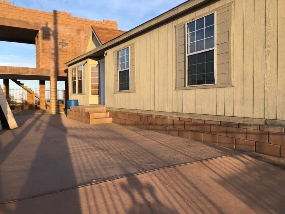 See the side exterior of Casa Parra in El Dorado Ranch San Felipe Baja California Mexico — showing windows, access, and outdoor space