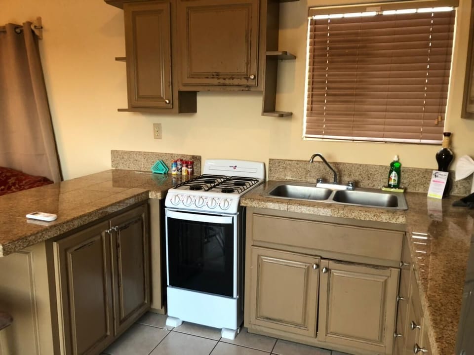 Cook with ease in the full kitchen of this Playas de San Felipe Baja California rental — stove, fridge, and counter space included.