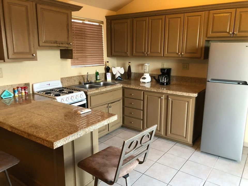Full kitchen with stove, fridge, and counter space at Casa Parra in El Dorado Ranch San Felipe BC MX — perfect for home cooking.