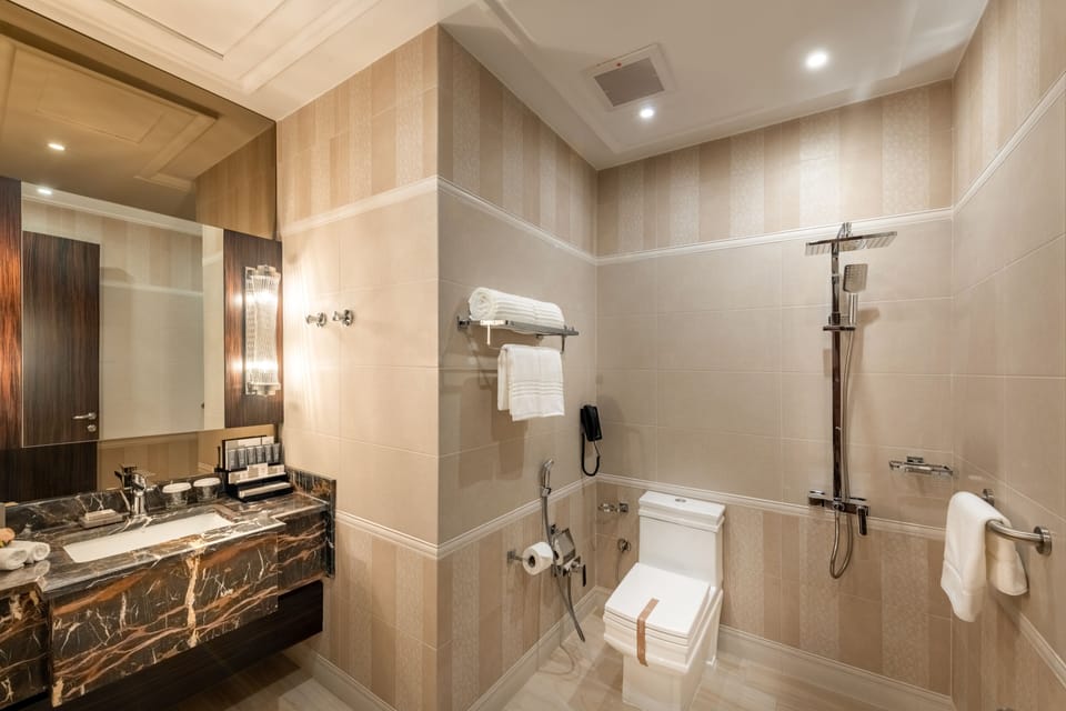 Designer toiletries, hair dryer, bathrobes, slippers