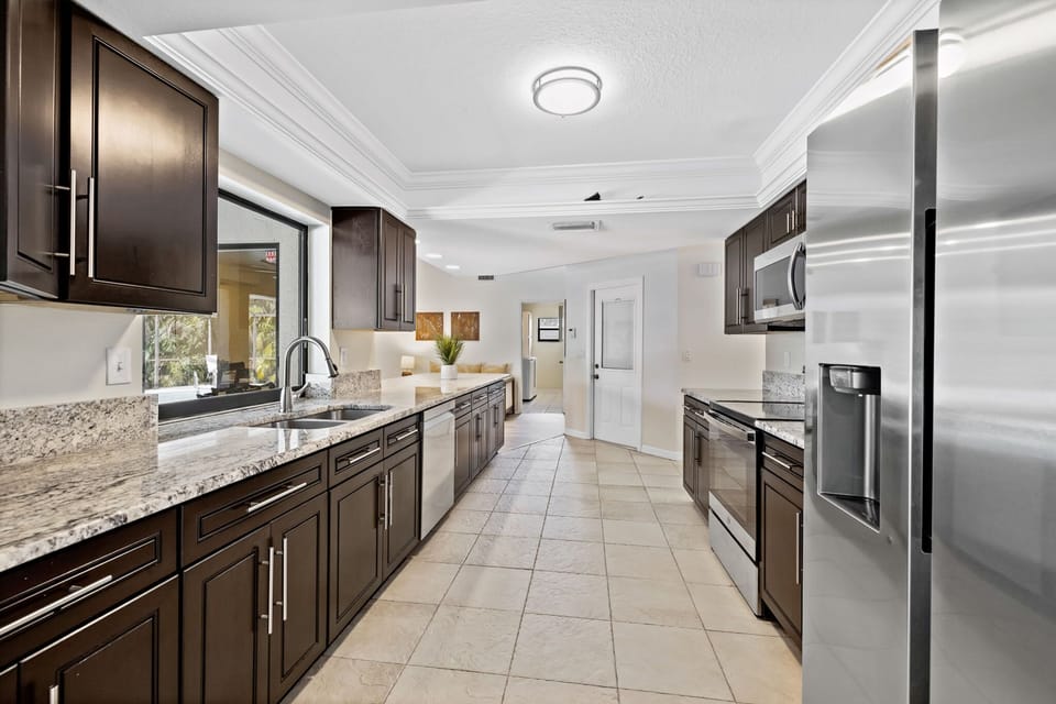 The kitchen is fully equipped with stainless steel appliances.
