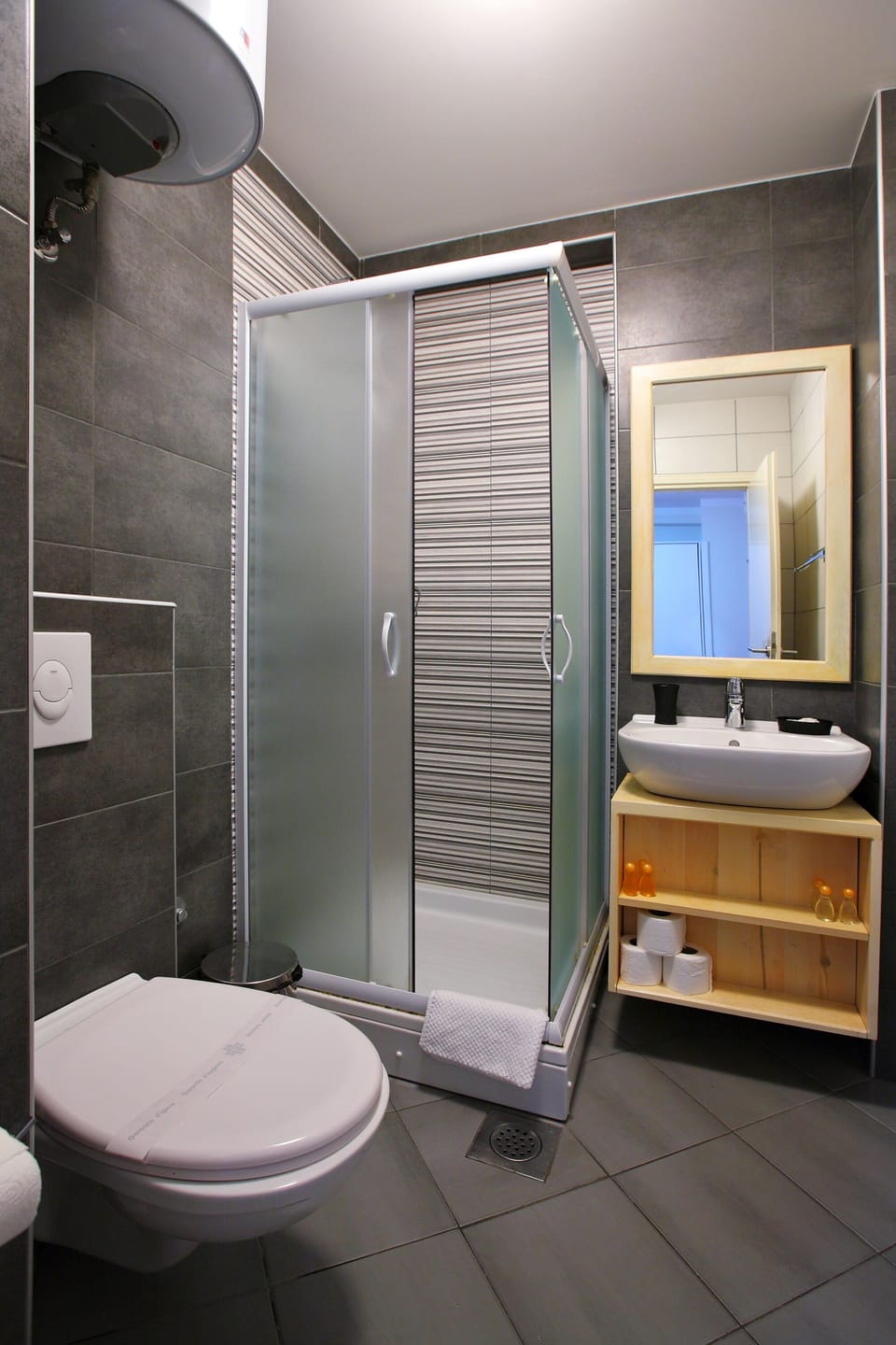 Shower, designer toiletries, hair dryer, slippers