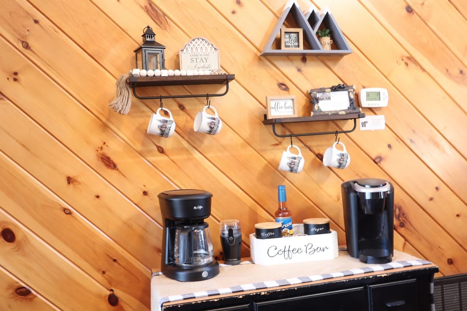 Fully loaded coffee bar: Coffee maker, Keurig, bean grinder, beans, flavored syrups, and electric kettle.   Enjoy your favorite hot drink on the private deck, while admiring the serene views!
