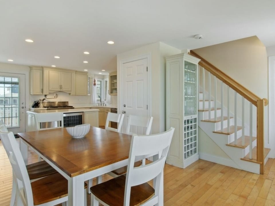 Kitchen in the background and ocean and beach views right in front of you. 