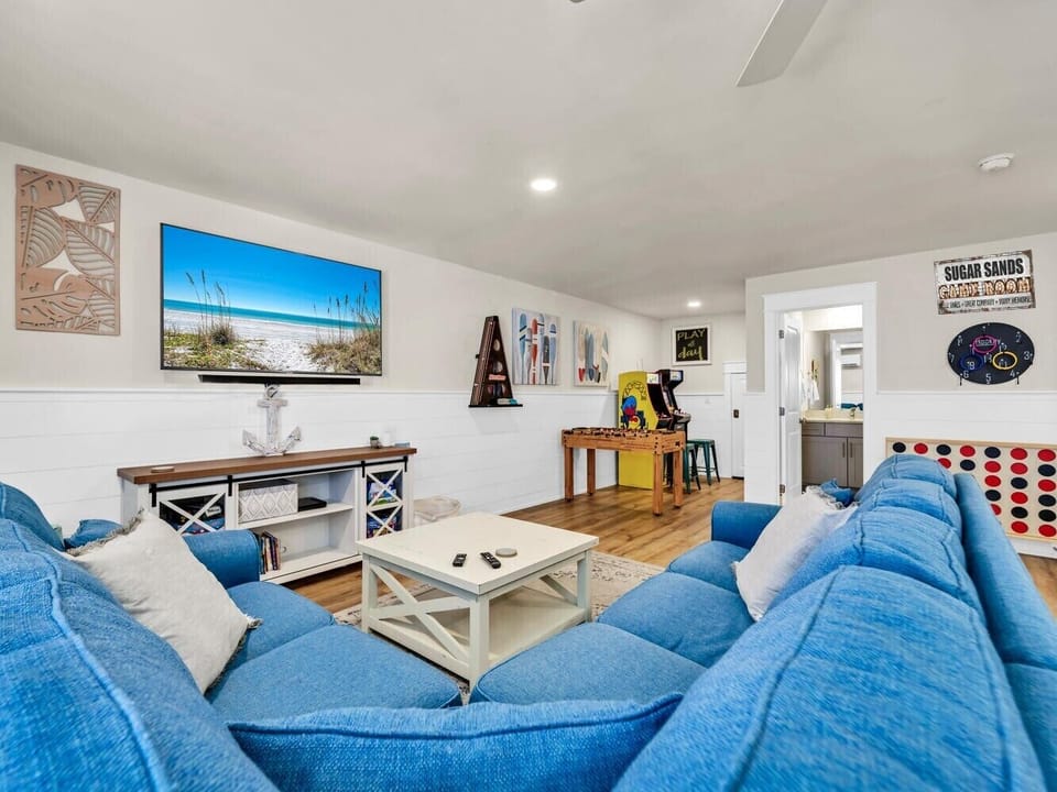 Spread out and enjoy a movie night in our loft/3rd Floor area featuring a second living room with a large Smart TV and entertainment and games.