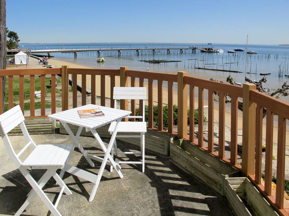 Sky, Water, Table, Property, Furniture, Chair, Wood, Outdoor Furniture, Building, Outdoor Table