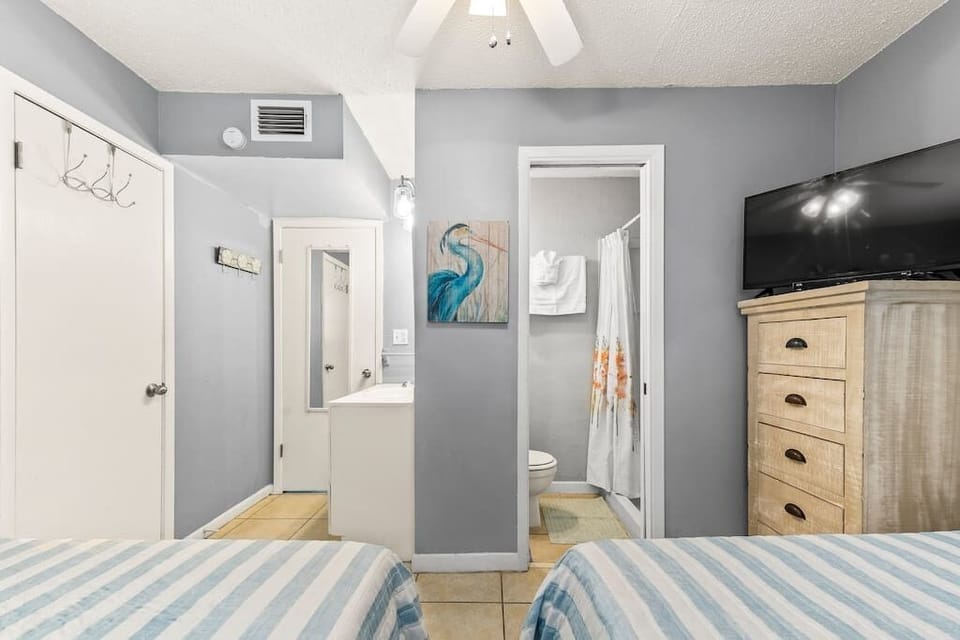 On suite bathroom with sink to left and stand up shower to right. Large closet to the left.