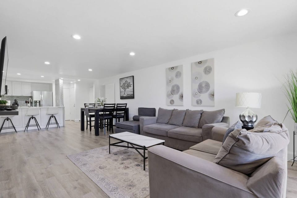 The open-concept layout creates the perfect gathering space for family vacations, golf trips, or long-term stays.