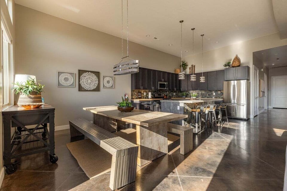 This dining area features a stunning farmhouse table that seats 8 comfortably, is perfect for big family dinners or festive get-togethers. The rustic charm and ample space invite you to relax and enjoy each other's company.