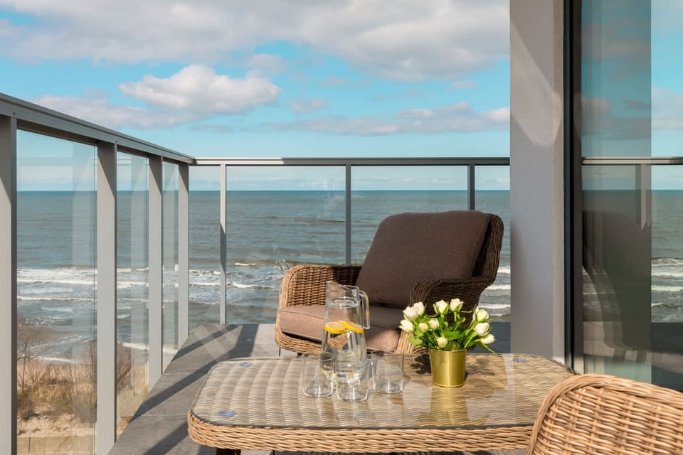 The balcony's stylish design complements the apartment's decor. 