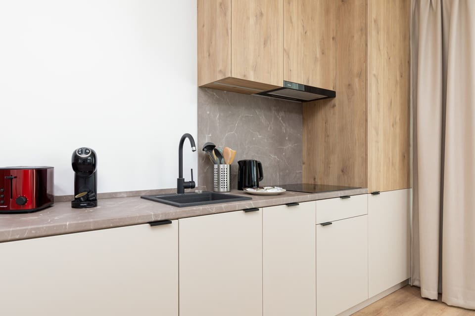 The fully equipped kitchenette includes everything you need for a home-cooked meal.