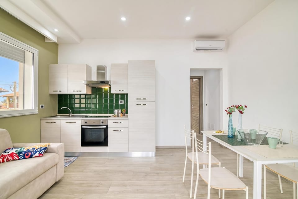Family Apartment, 1 Bedroom, Balcony, Sea Facing (Corallo House 200m From The Sea) | Private kitchen | Dining tables