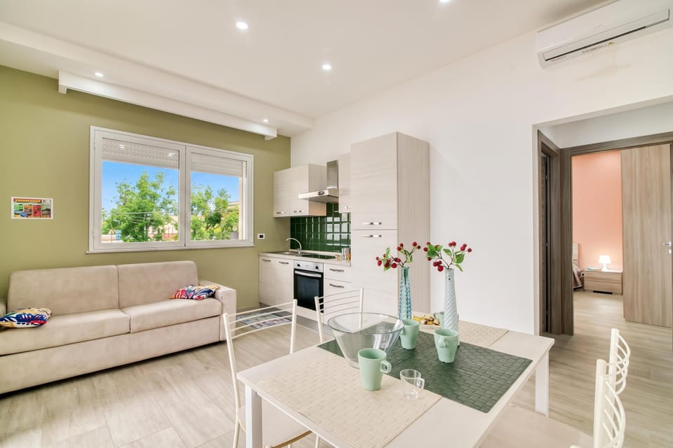 Family Apartment, 1 Bedroom, Balcony, Sea Facing (Corallo House 200m From The Sea) | Living area | Flat-screen TV