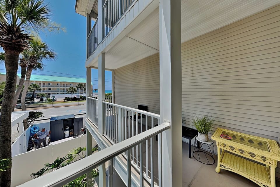 Furnished L-Shaped Balcony - Gulf + Pool View