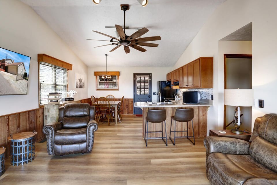 Luxury vinyl plank floors and 4 seat reclining sofa and chair.