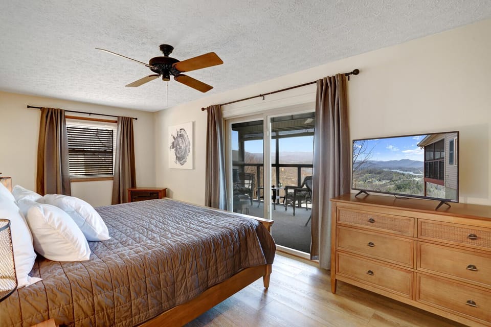 Main level Master bedroom with gorgeous views and screen in porch. 