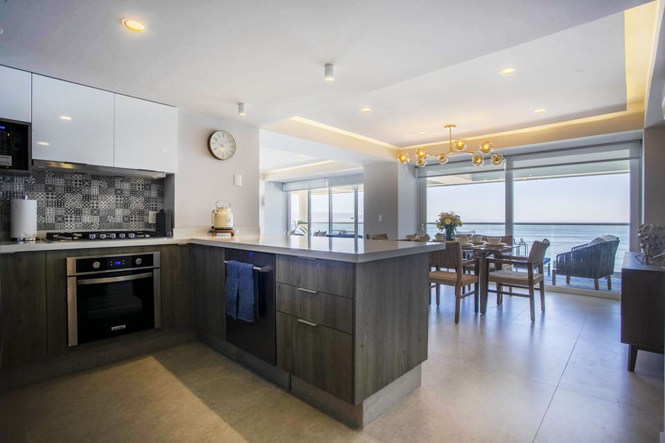 The ocean can be seen while you cook in the kitchen