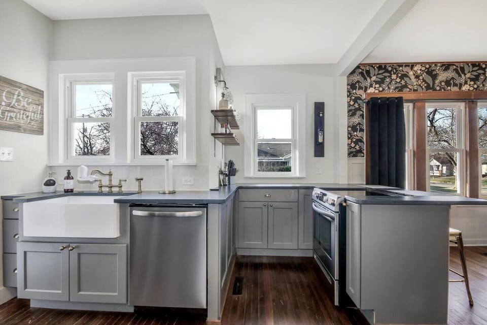 Sunny kitchen is fully stocked with everything needed to cook a meal.  Stove is electric.