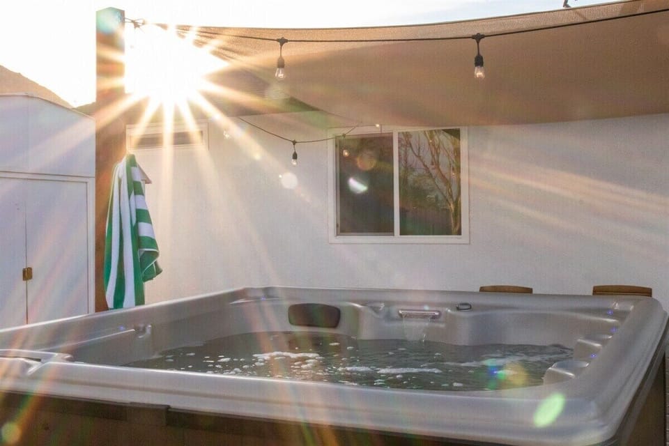Enjoy our hot tub, just steps from the back door. 
