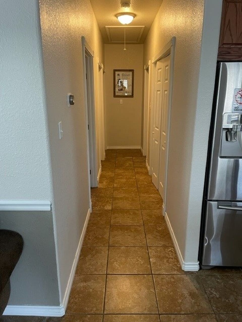Hallway that includes Utility Room with Washer and Dryer