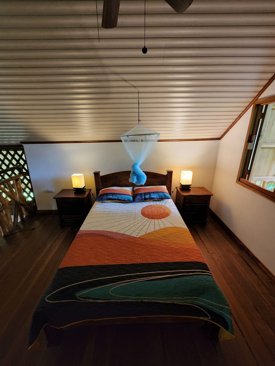Bed, nightstands, and lights. 