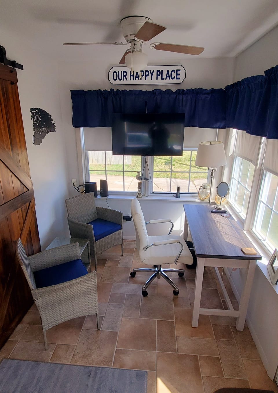 Office/sunroom with new desk, chairs and 40" smart tv