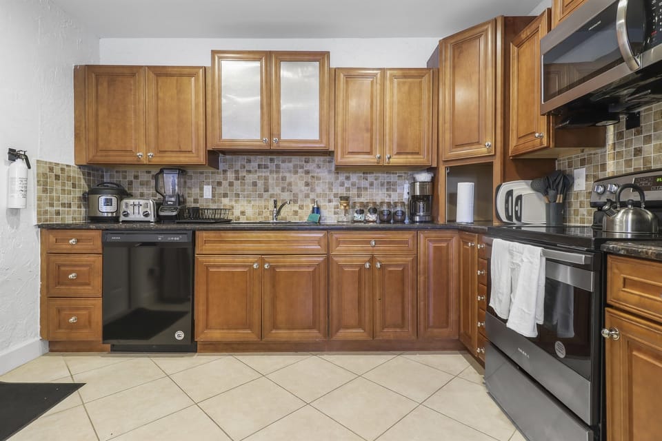 FULLY STOCKED KITCHEN: stainless steel pots and pans, instant, Ninja blender, serving trays everything for large groups!