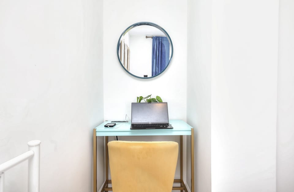 There is a desk and working chair with incorporated outlets on the bedroom #2 (where the 2 twin beds are)