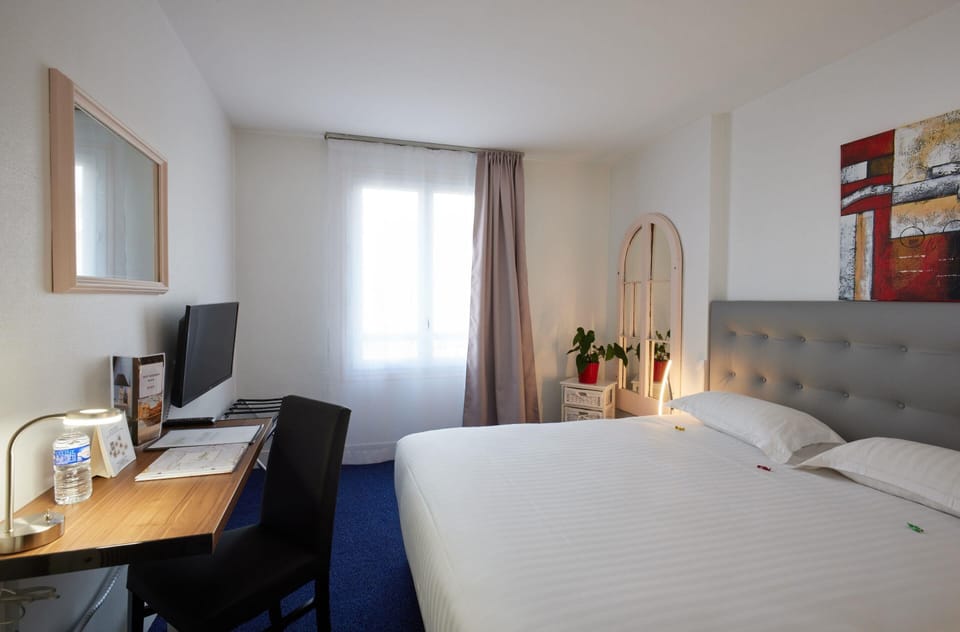 Premium bedding, desk, laptop workspace, iron/ironing board