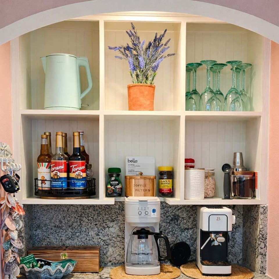 A charming beverage bar stocked for every craving. Brew fresh coffee, espresso, or tea with ease, choose from flavored syrups and quality blends, and enjoy a cozy café-style setup with the bella VersaBrew 2-in-1 Coffee System.