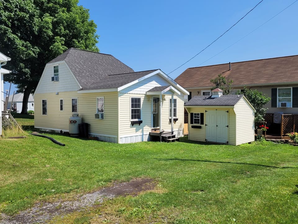 The cottage has one parking space and it's right there in front of the shed.